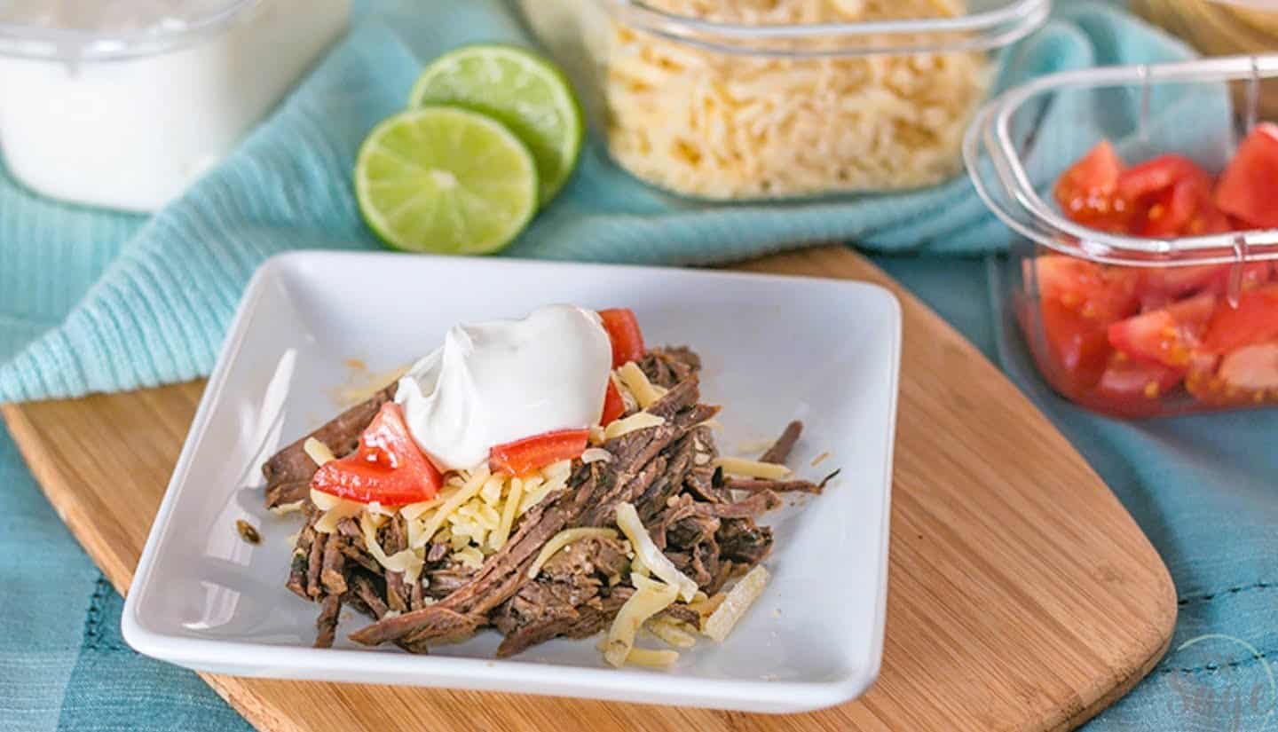  slow cooker Mexican shredded beef flavored with chili and lime.