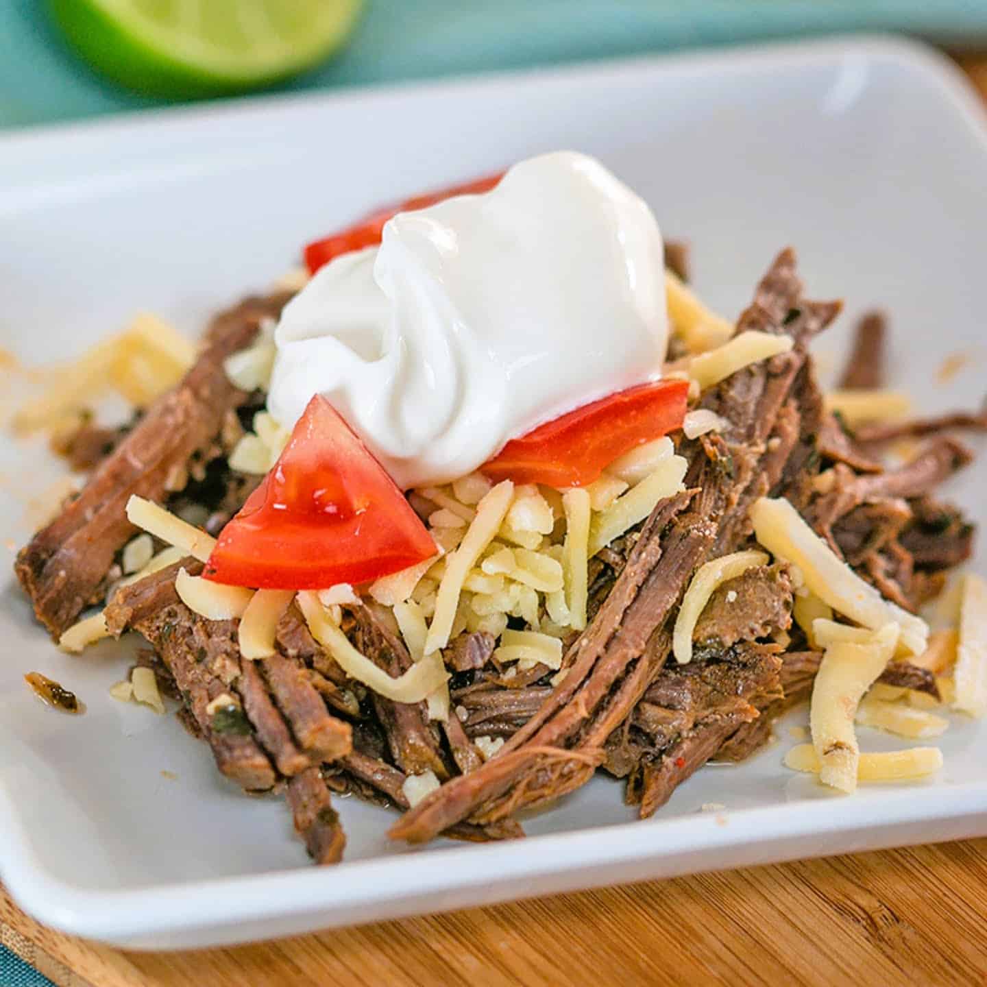  slow cooker Mexican shredded beef flavored with chili and lime.