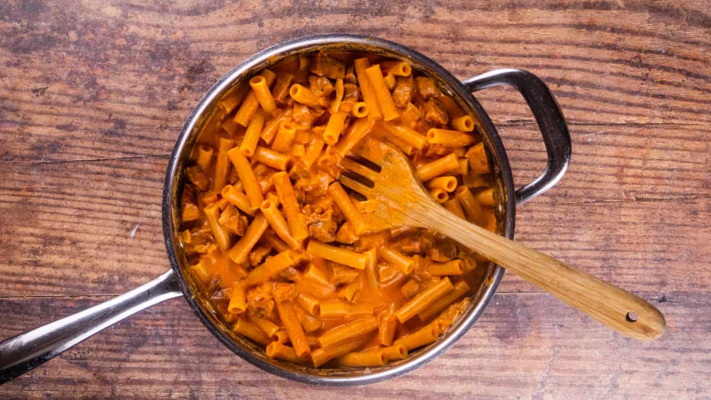 cajun pasta dish cooking in a pan
