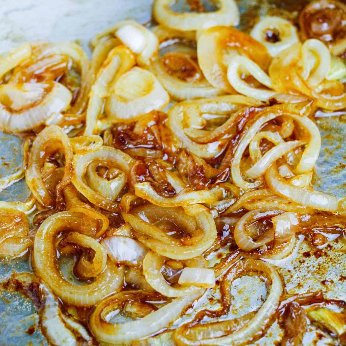 onions cooking in a pan