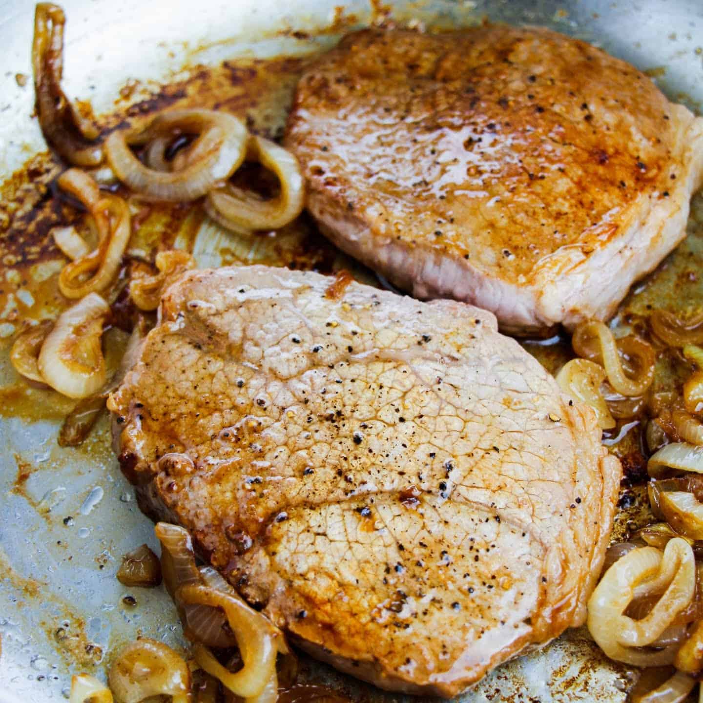 steak and onions cooking