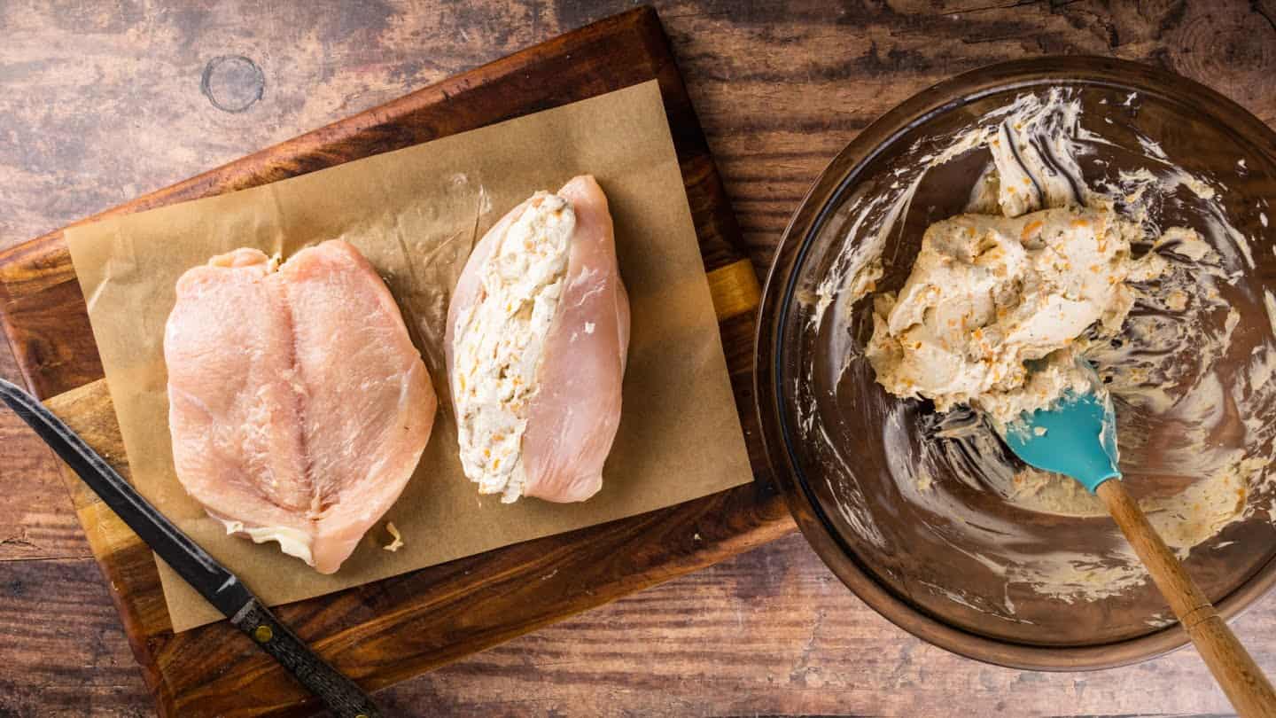 chicken breasts on a chopping board