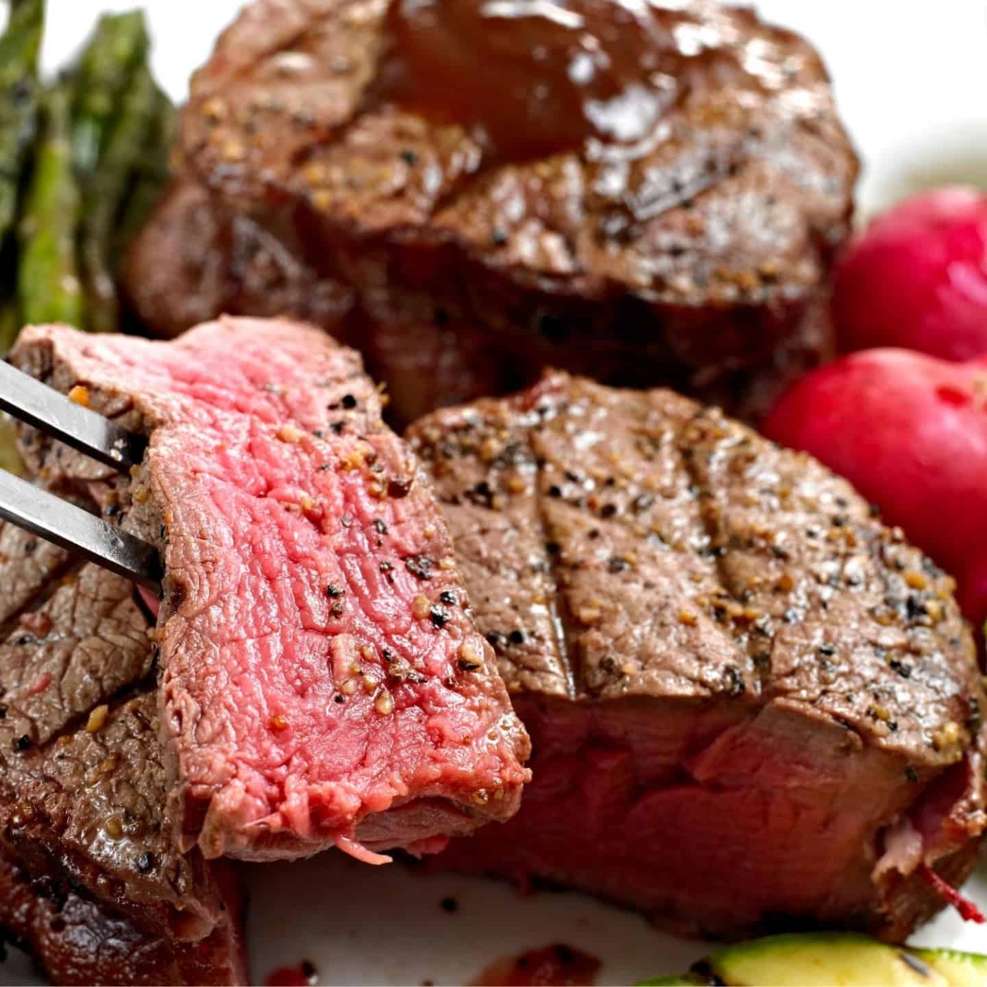 top sirloin filet steak cooked to medium-rare with pepper and salt