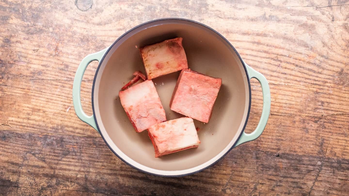 Beef ribs in skillet for boiling