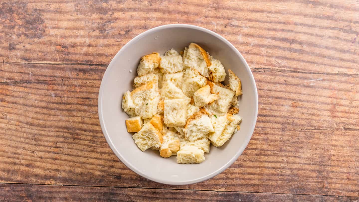 Broken bread soaked in milk in a bowl