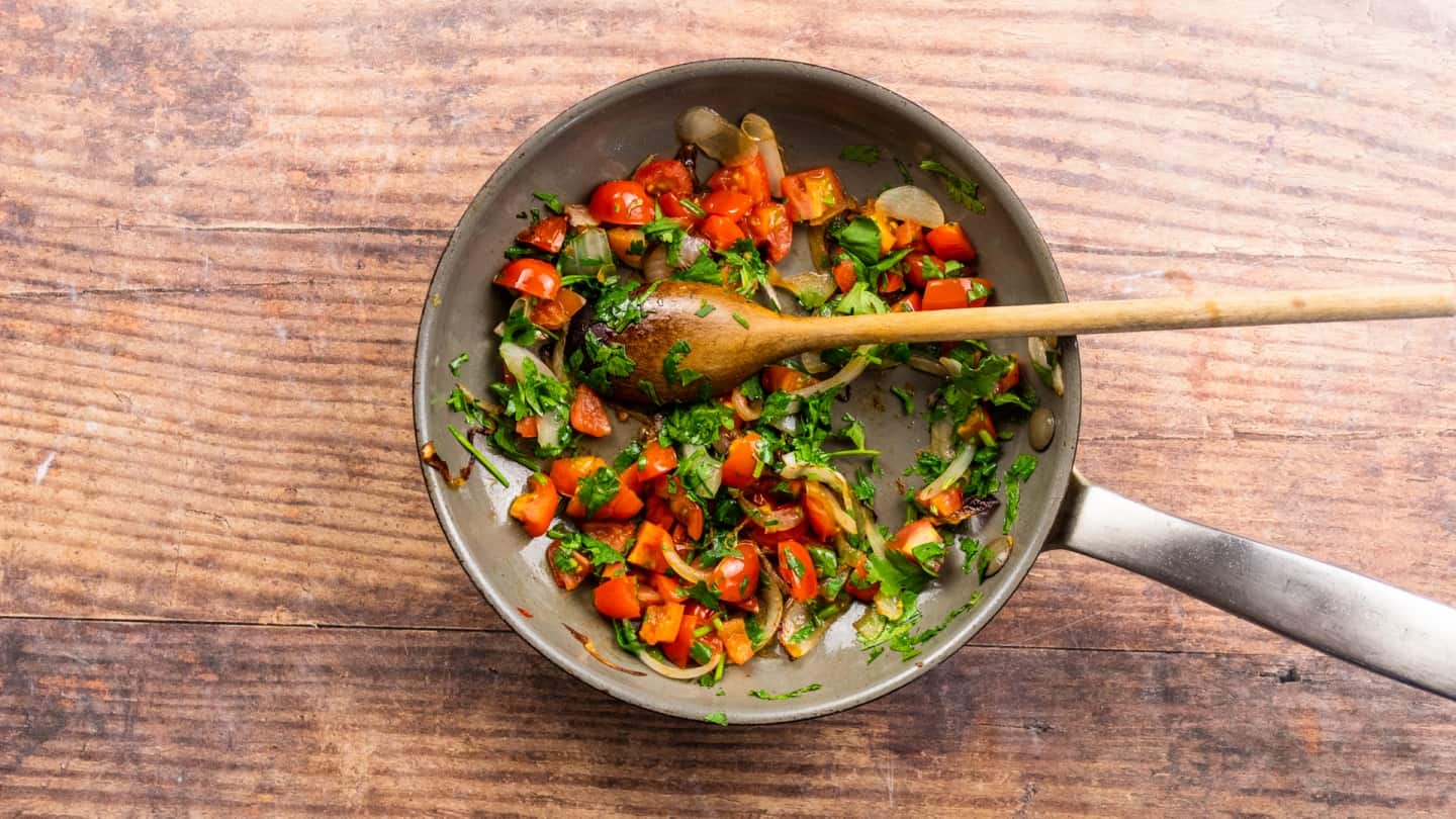 Frying the onion, tomatoes and cilantro