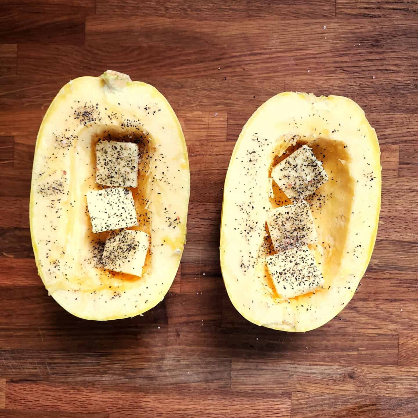 Salt and pepper in spaghetti squash halves