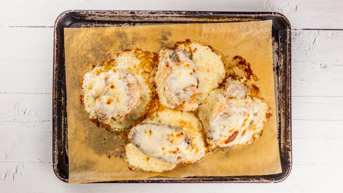 Broiling the chicken until cheese browns