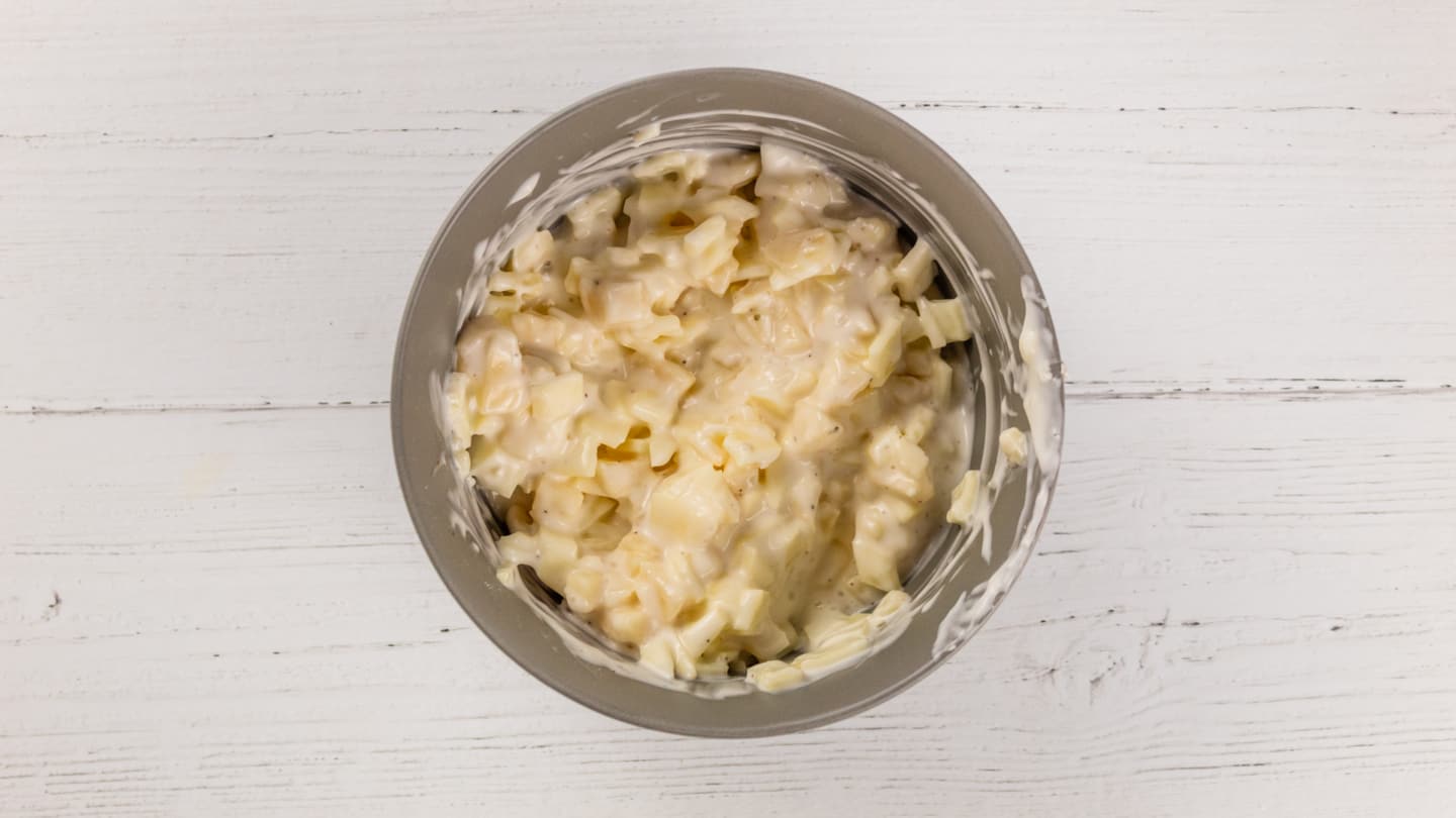 Combination of cheeses and ranch dressing in bowl