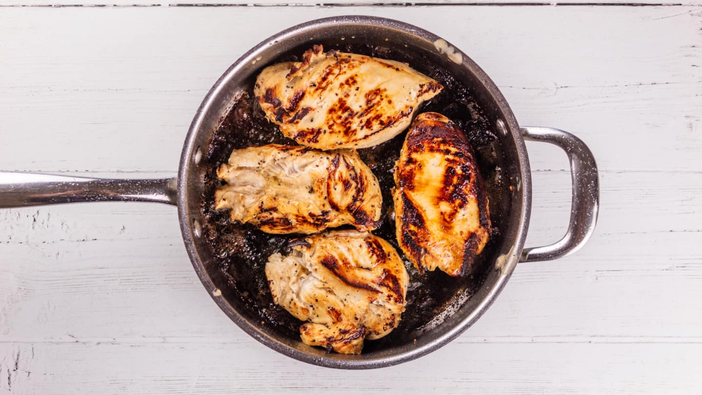 Searing the chicken in skillet