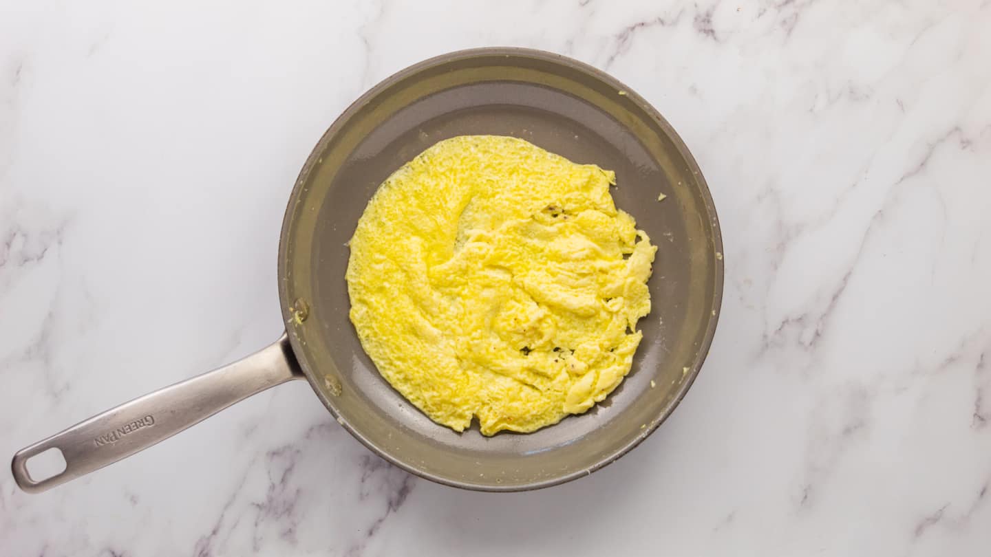 Add ¼ of eggs in the pan