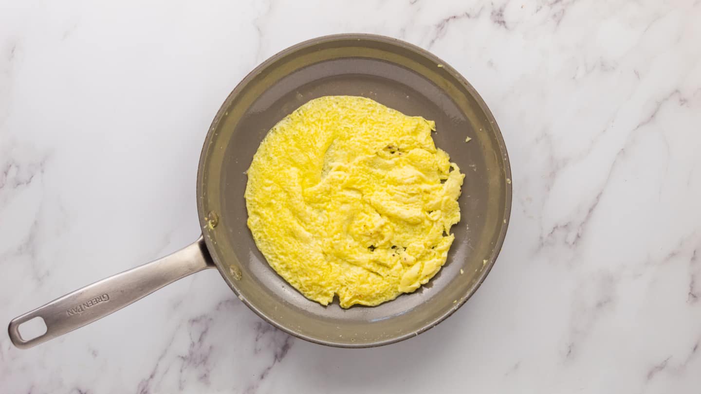 add ¼ of eggs in the pan