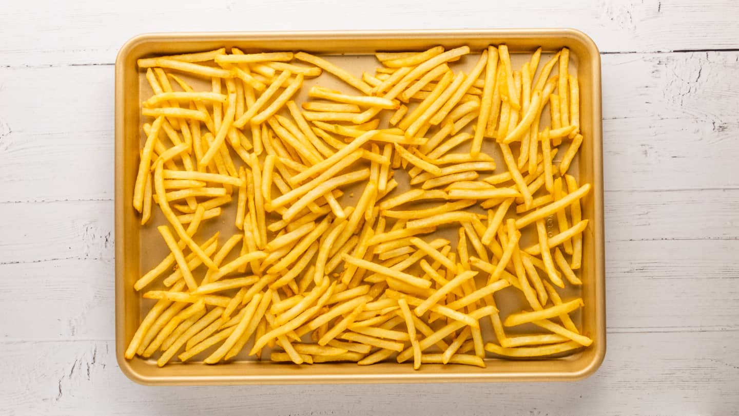  place the frozen fries in a single layer across the tray.