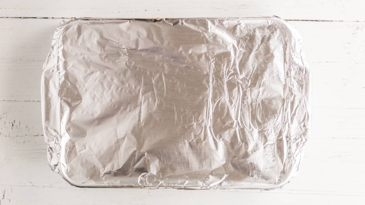 Cover the baking dish with aluminum foil and bake in the preheated oven for 25 minutes.