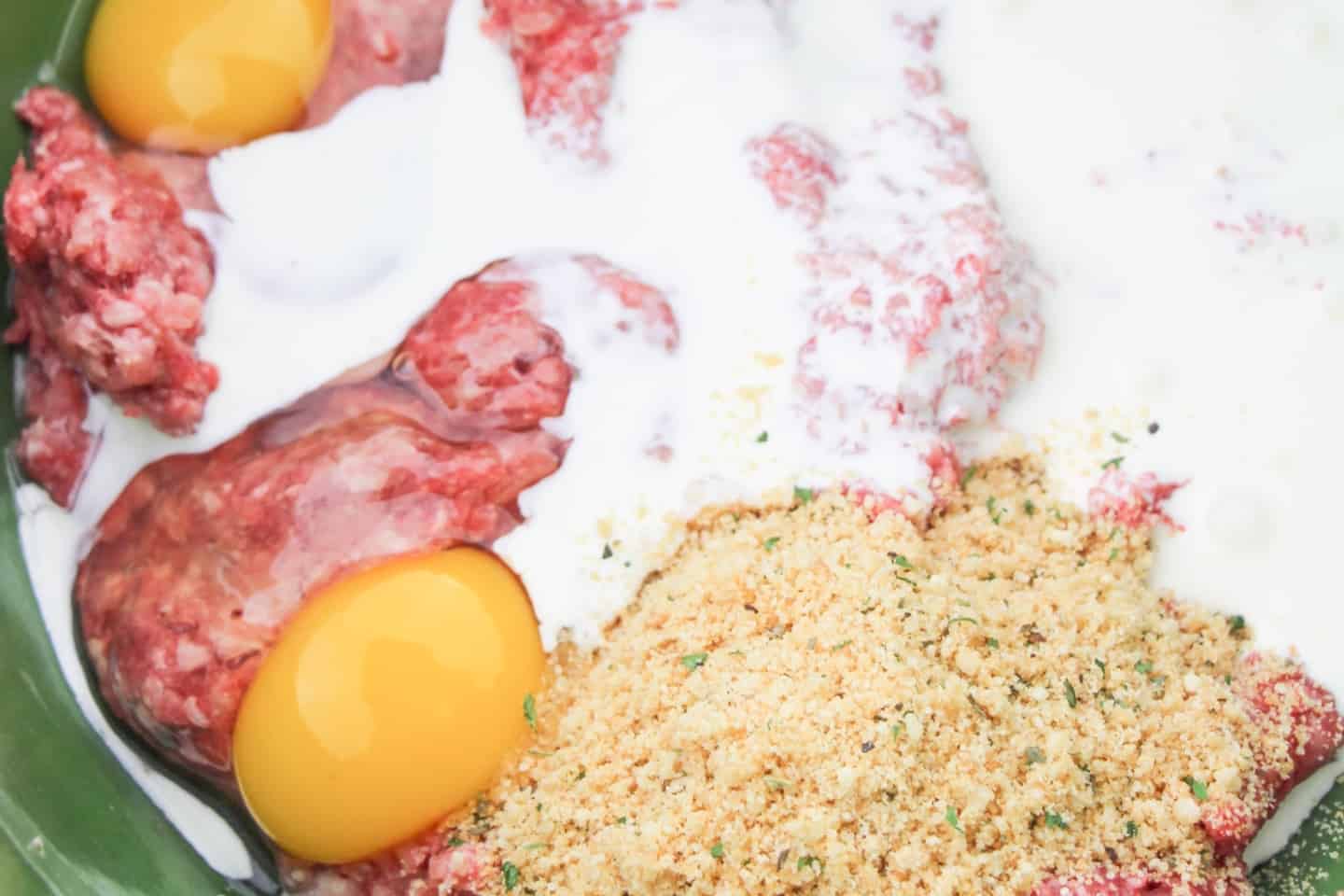 Combine the meatball ingredients in a large mixing bowl and roll them with the palm of your hand into round balls